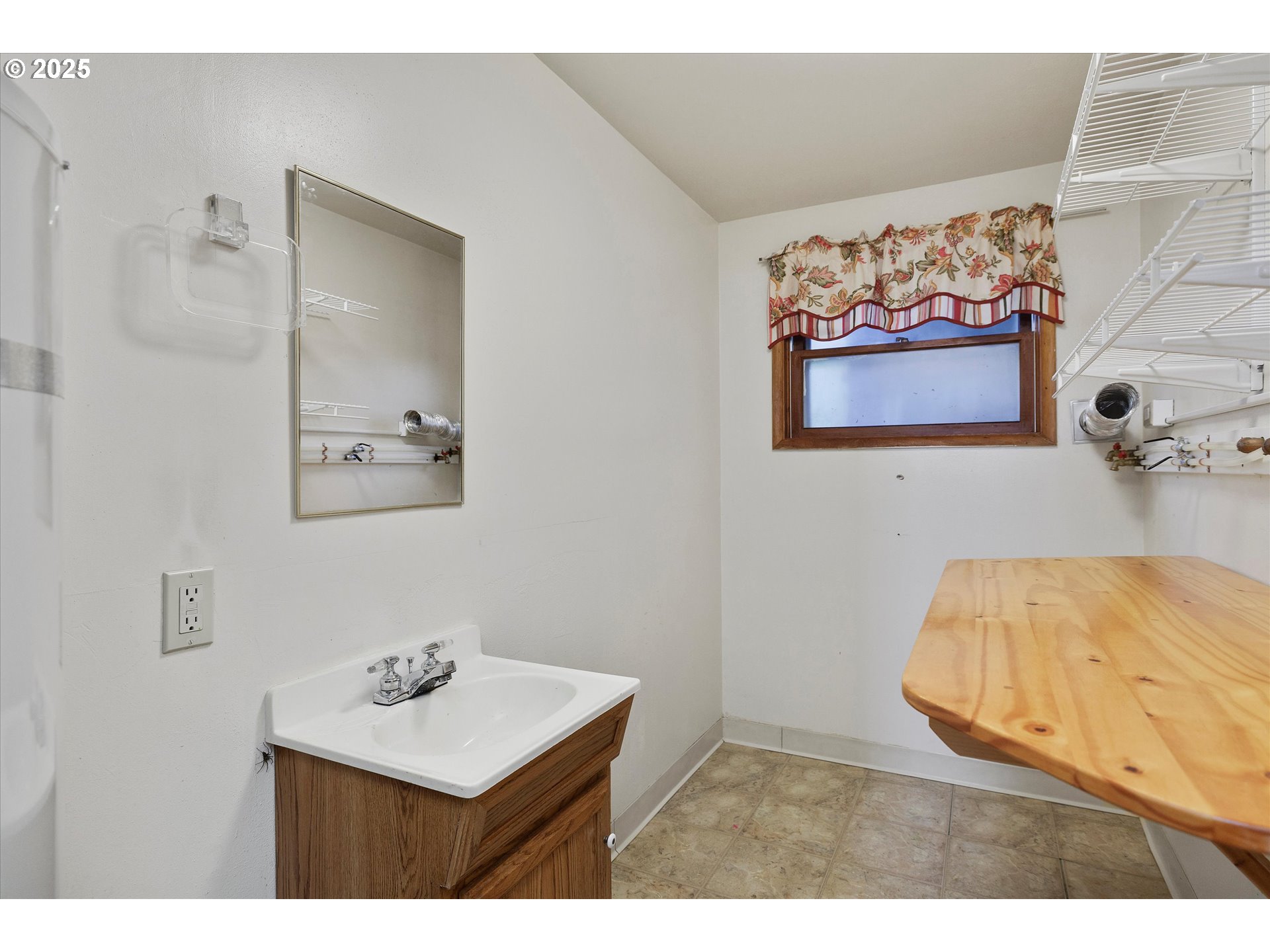 1360 Northwest 130th Avenue Portland, OR 97229 - Photo 26 of 36 a bedroom with a bed and a painting on the wall