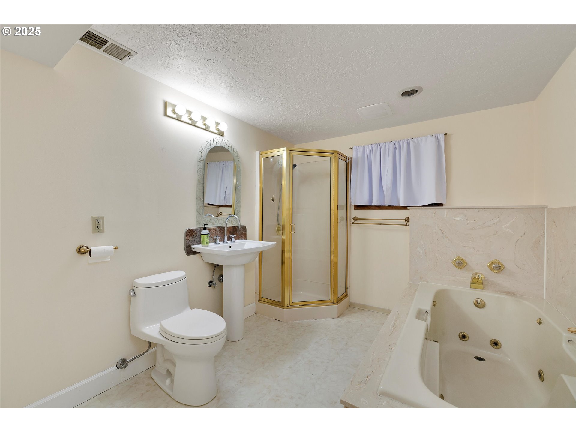 1360 Northwest 130th Avenue Portland, OR 97229 - Photo 31 of 36 a bathroom with a sink toilet a mirror and shower