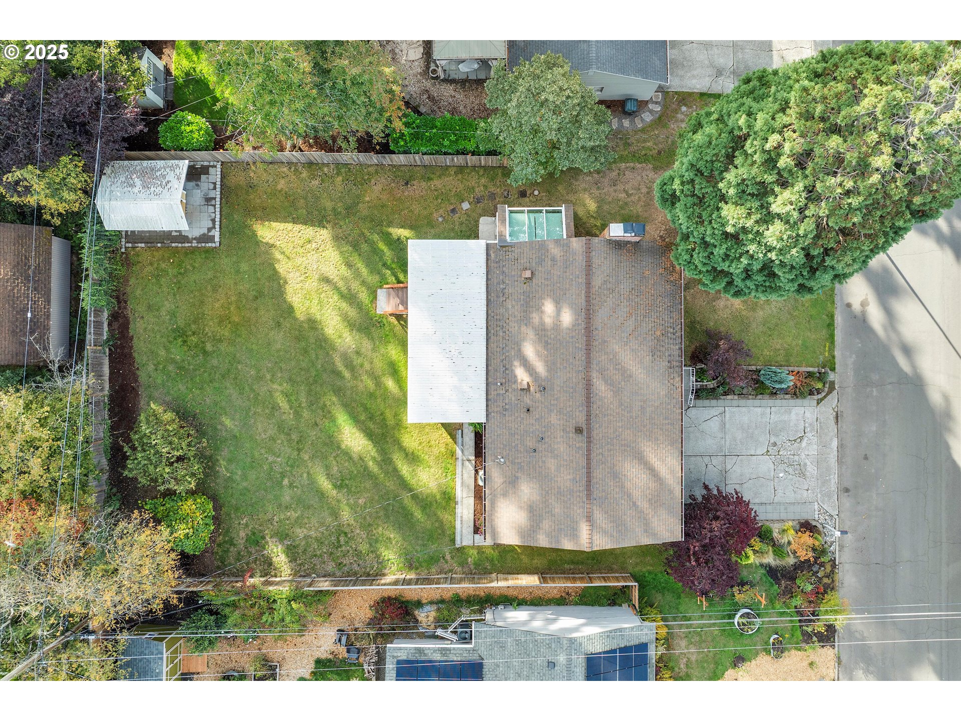 1360 Northwest 130th Avenue Portland, OR 97229 - Photo 5 of 36 an aerial view of a house with a garden and lake view