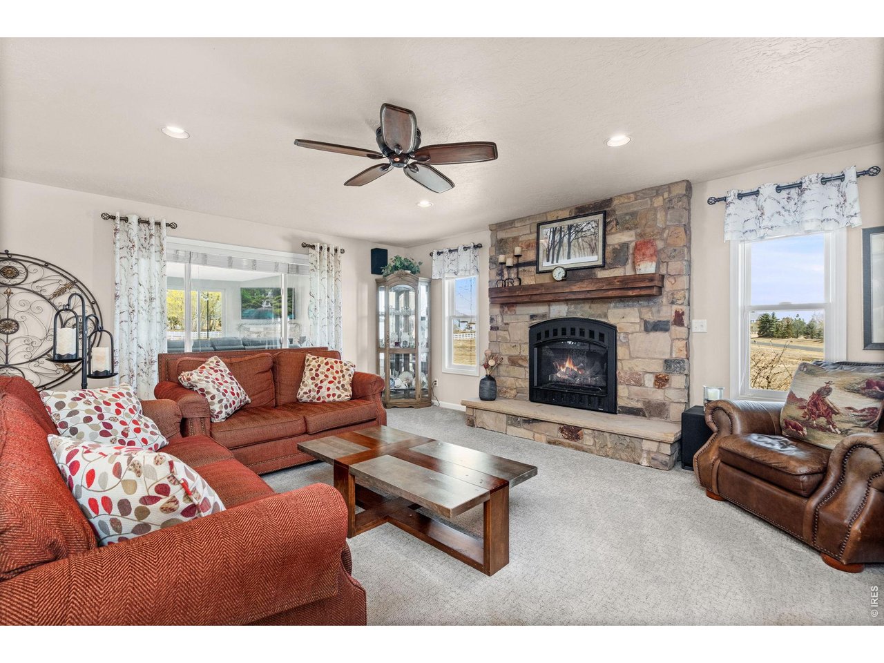 6345 Lesser Drive Greeley, CO 80634 - Photo 14 of 47 Living room with gas fireplace