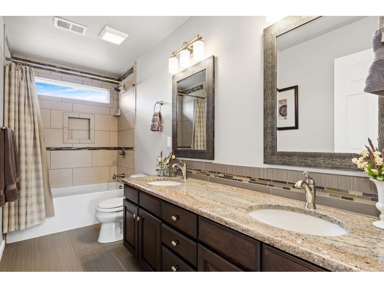 6345 Lesser Drive Greeley, CO 80634 - Photo 35 of 47 Upper hall bathroom - double sinks, tub with shower