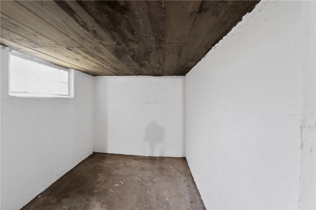 205 Rita Street Dayton, OH 45404 - Photo 24 of 34 This versatile basement space features a concrete floor and a wood plank ceiling.