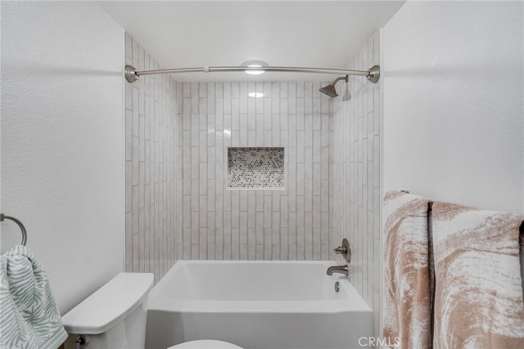 34112 Selva Road, Unit 329 Dana Point, CA 92629 - Photo 17 of 34 a bathroom with a bathtub toilet and shower