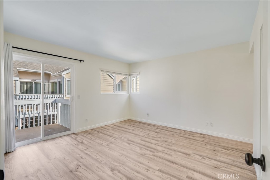 34112 Selva Road, Unit 329 Dana Point, CA 92629 - Photo 20 of 34 wooden floor in an empty room with a window