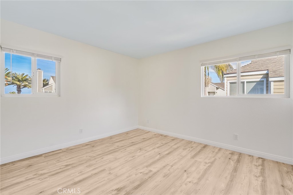 34112 Selva Road, Unit 329 Dana Point, CA 92629 - Photo 27 of 34 a view of empty room with wooden floor and fan