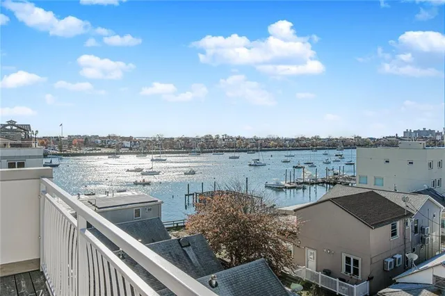 a balcony with table and chairs