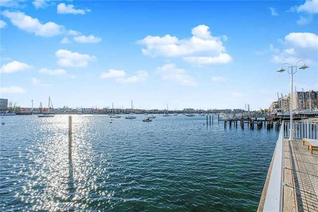 a view of a patio with swimming pool and sitting area
