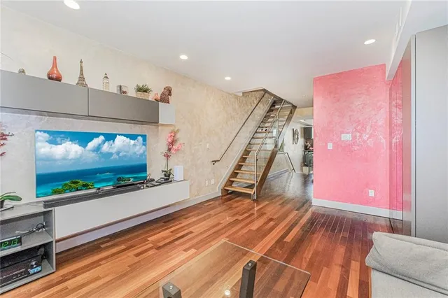 a view of an empty room with a flat screen tv