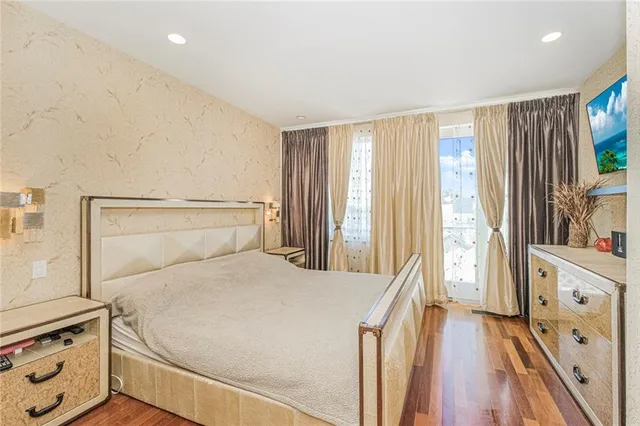 a large white bed in a white room