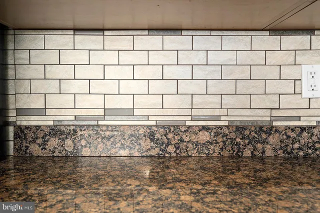 a kitchen with stainless steel appliances granite countertop a refrigerator stove microwave and sink