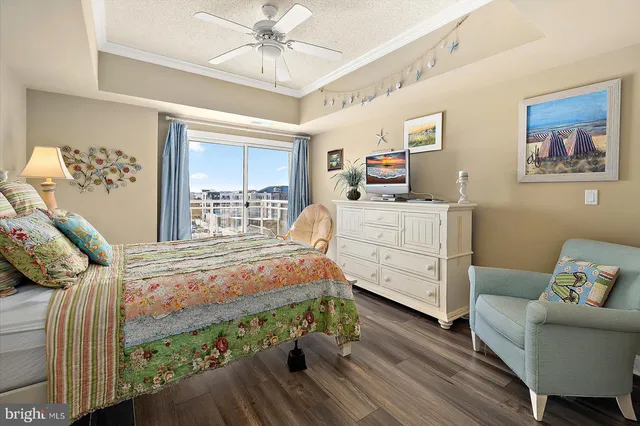 a bedroom with bed and a chandelier