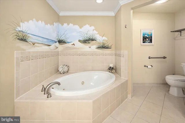 a bedroom with two beds and a flat screen tv