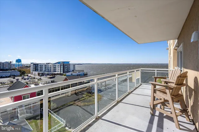a view of a balcony with chairs