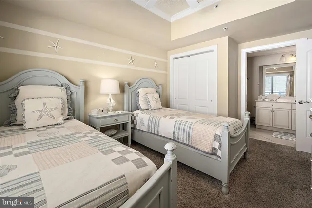 a bedroom with a bed and a dresser in it