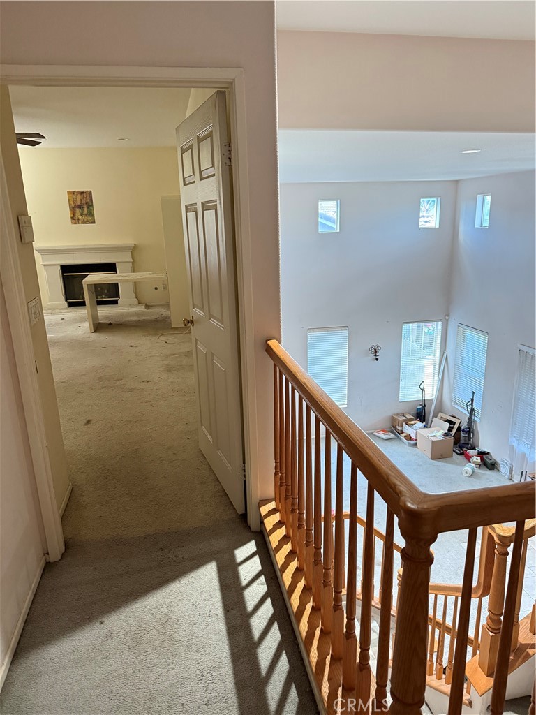 13571 Canyon Crest Way Eastvale, CA 92880 - Photo 12 of 23 a view of a hallway to a livingroom with furniture