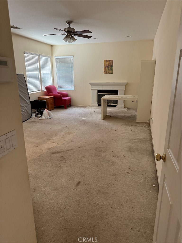 13571 Canyon Crest Way Eastvale, CA 92880 - Photo 13 of 23 a living room with furniture and a window