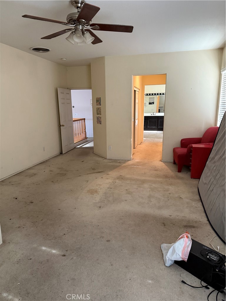 13571 Canyon Crest Way Eastvale, CA 92880 - Photo 14 of 23 a view of an empty room with a window