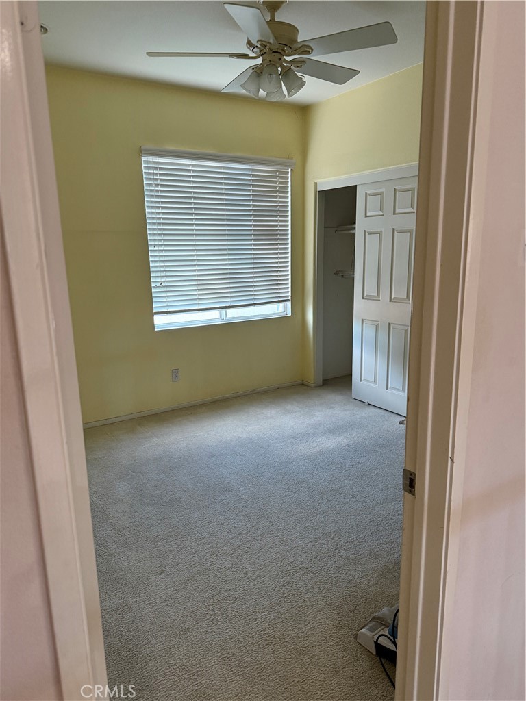 13571 Canyon Crest Way Eastvale, CA 92880 - Photo 18 of 23 a view of an empty room with a window