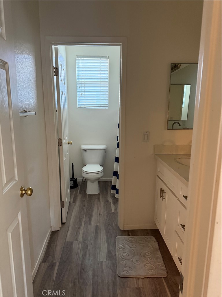 13571 Canyon Crest Way Eastvale, CA 92880 - Photo 20 of 23 a bathroom with a sink a toilet and shower