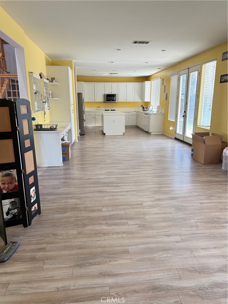 13571 Canyon Crest Way Eastvale, CA 92880 - Photo 4 of 23 a living room with furniture and a flat screen tv