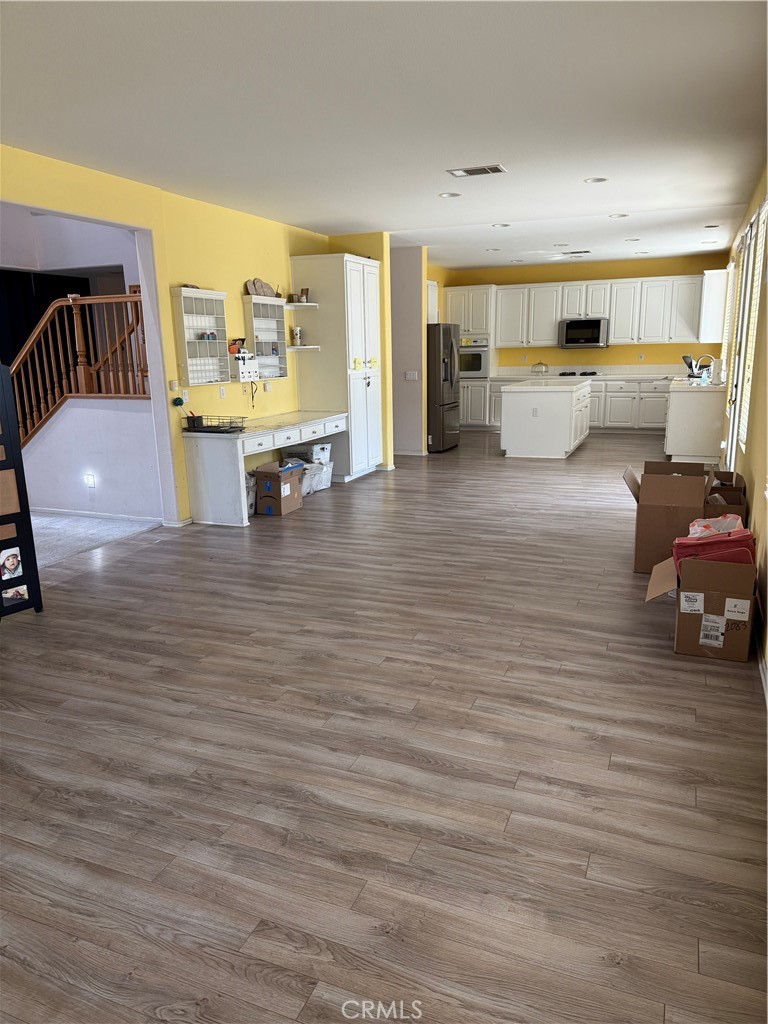 13571 Canyon Crest Way Eastvale, CA 92880 - Photo 5 of 23 a living room with furniture and a wooden floor