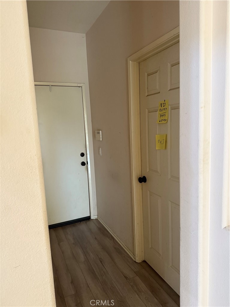 13571 Canyon Crest Way Eastvale, CA 92880 - Photo 9 of 23 a view of a hallway with wooden floor
