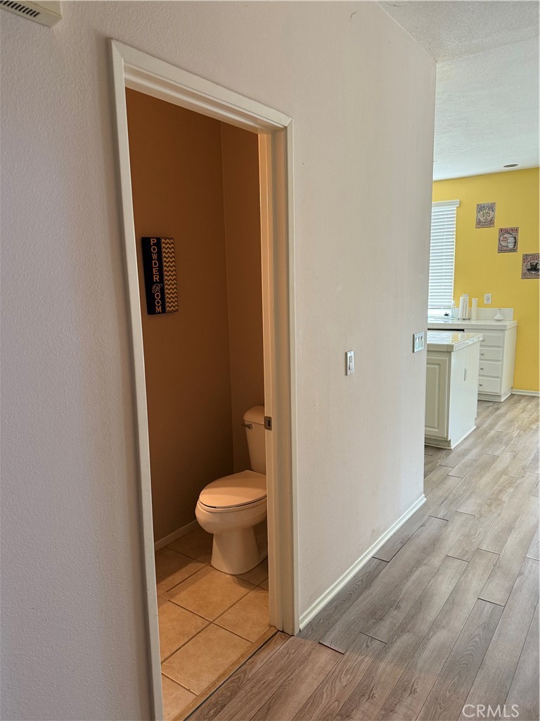 13571 Canyon Crest Way Eastvale, CA 92880 - Photo 10 of 23 a bathroom with a toilet and a shower
