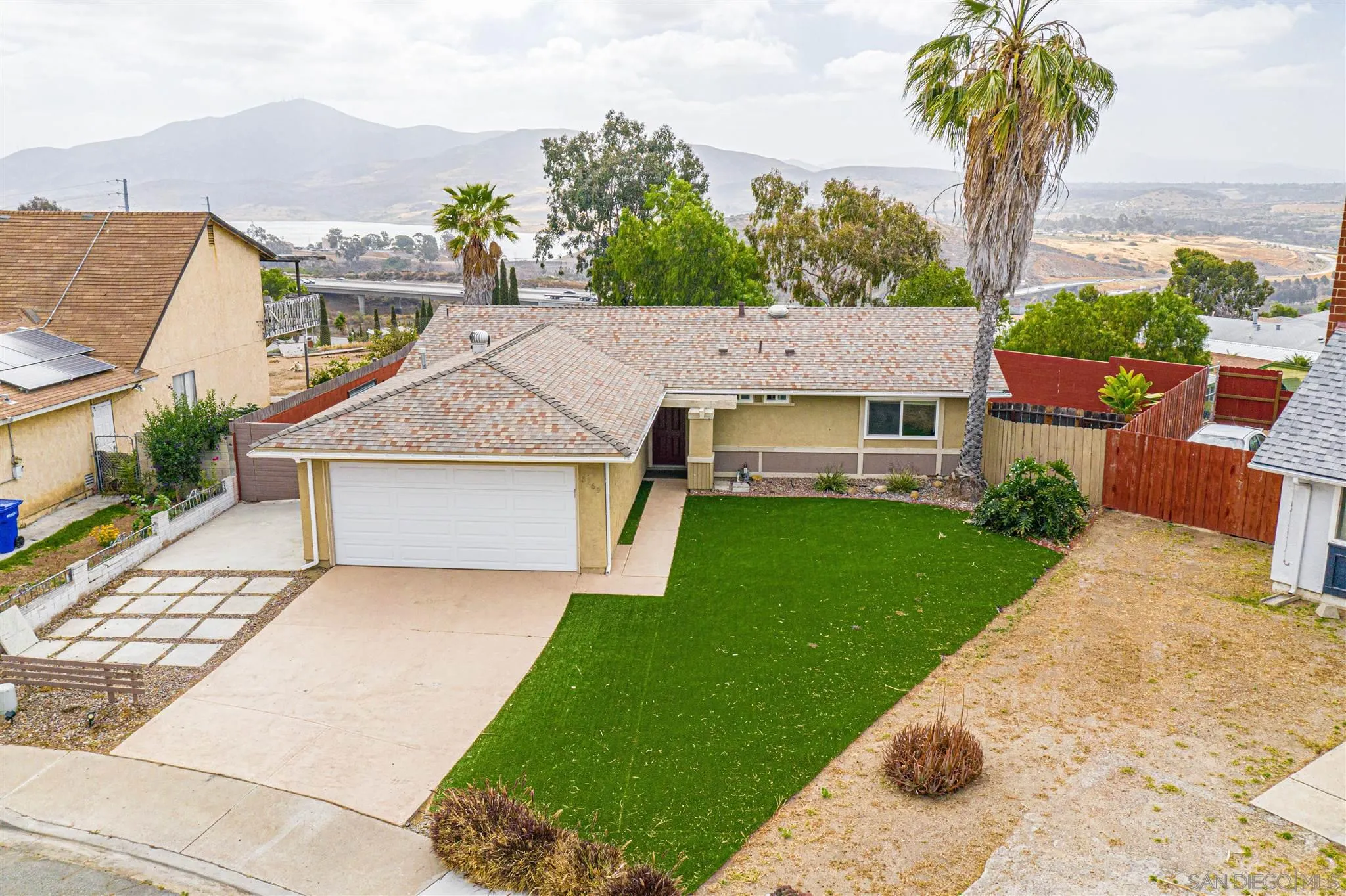 8269 Water View Court Spring Valley, CA 91977 - Photo 1 of 14 front view of house with a yard and potted plants