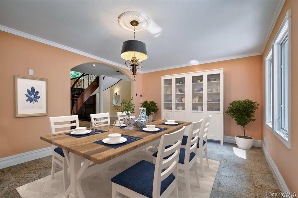 262 Harbor Acres Road Port Washington, NY 11050 - Photo 9 of 27 a view of a dining room with furniture wooden floor and chandelier
