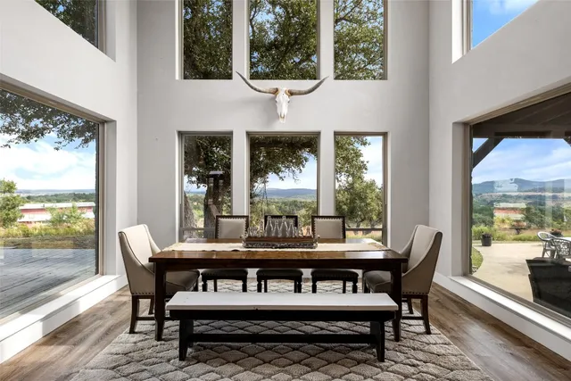 a dining room with furniture wooden floor and a potted plant