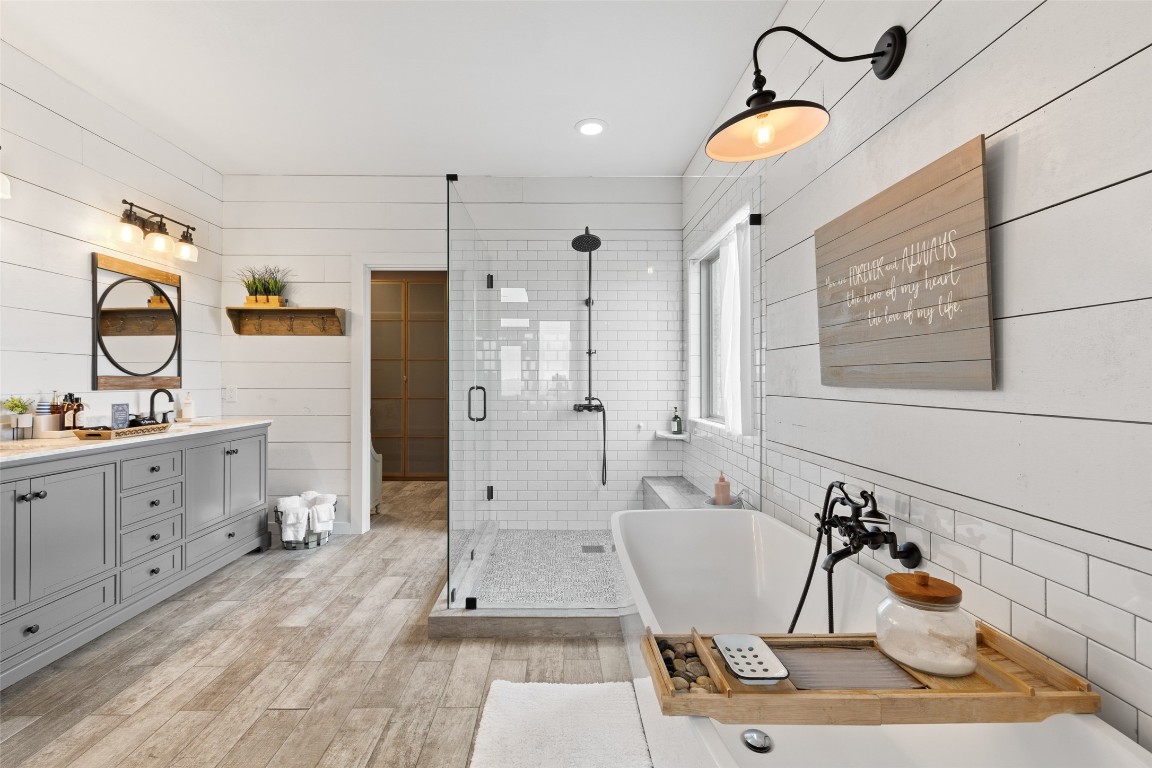 3108 Rolling Hills Road Blanco, TX 78606 - Photo 16 of 39 a bathroom with a sink mirror and shower
