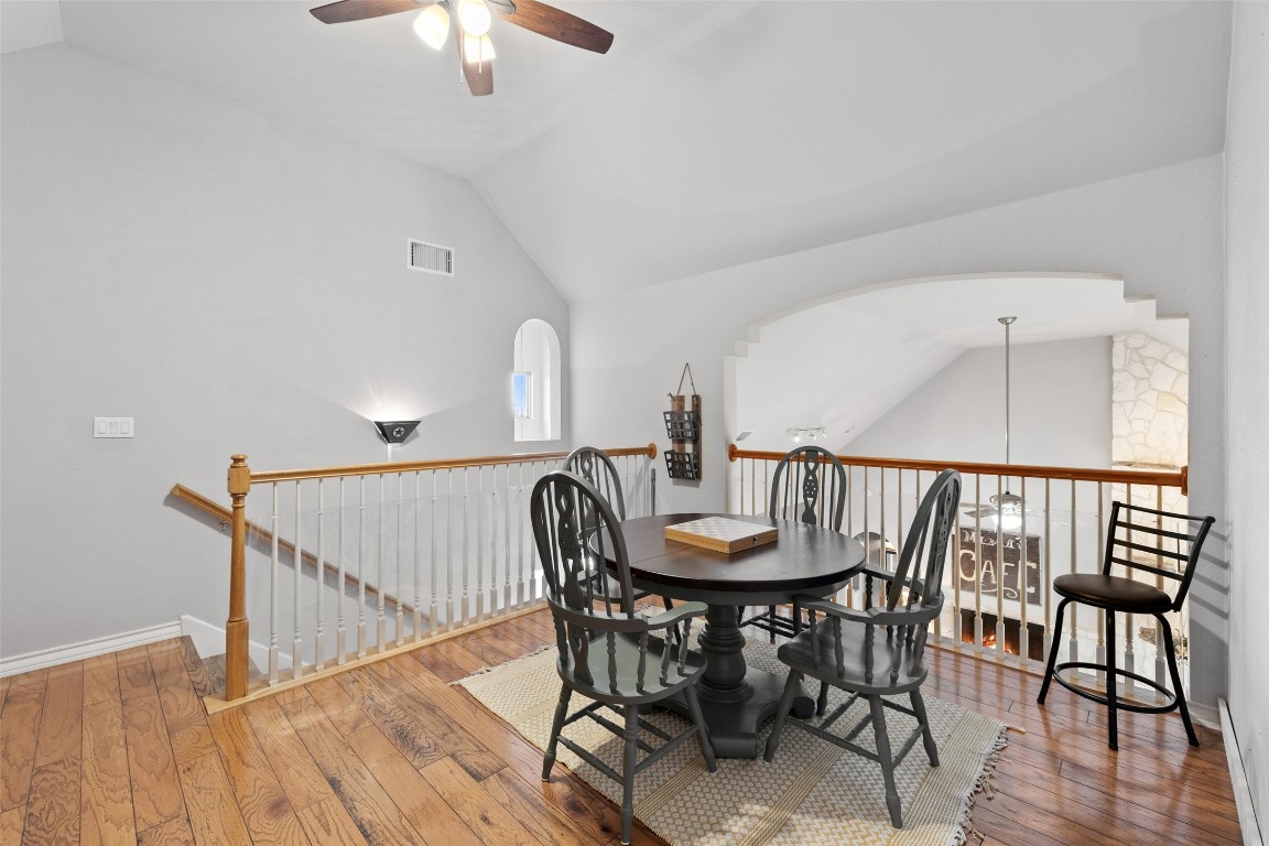 3108 Rolling Hills Road Blanco, TX 78606 - Photo 20 of 39 a view of a dining room with furniture and wooden floor