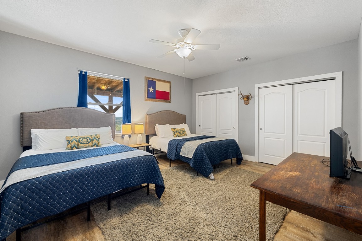 3108 Rolling Hills Road Blanco, TX 78606 - Photo 22 of 39 a bedroom with a bed and a table