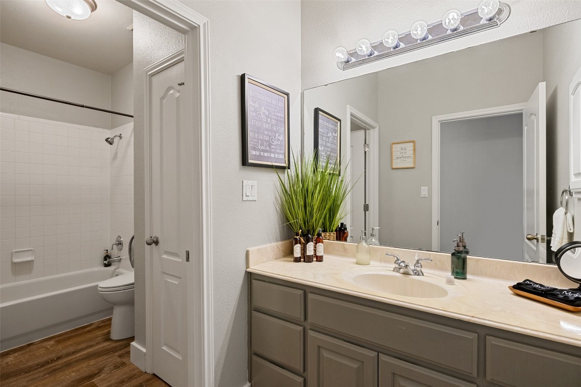 3108 Rolling Hills Road Blanco, TX 78606 - Photo 24 of 39 a bathroom with a tub sink and mirror
