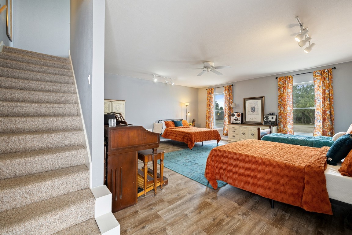 3108 Rolling Hills Road Blanco, TX 78606 - Photo 26 of 39 a bedroom with two beds and large windows