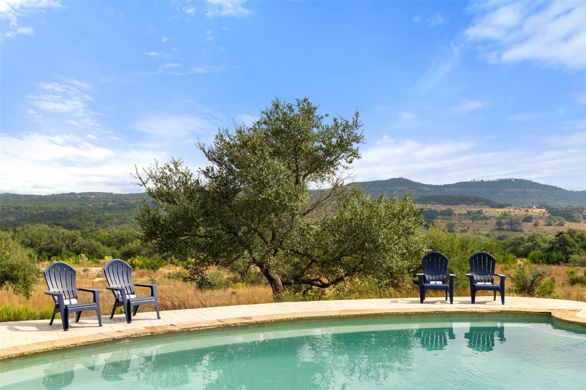 3108 Rolling Hills Road Blanco, TX 78606 - Photo 34 of 39 a view of a lake with a mountain