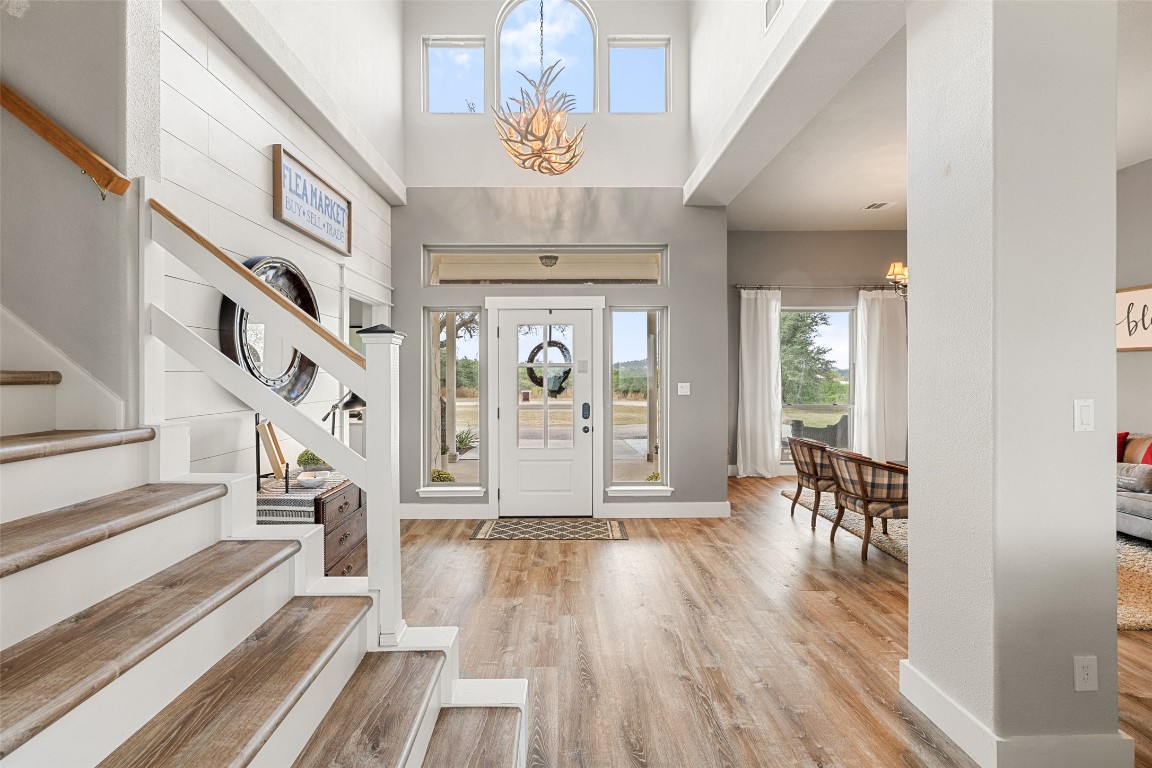 3108 Rolling Hills Road Blanco, TX 78606 - Photo 5 of 39 a view of a hallway with wooden floor and staircase