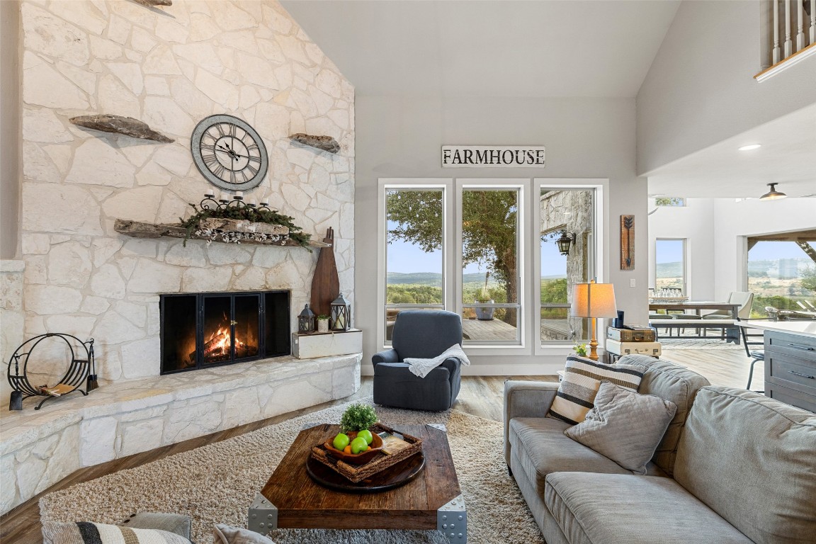 3108 Rolling Hills Road Blanco, TX 78606 - Photo 6 of 39 a living room with furniture and a fireplace