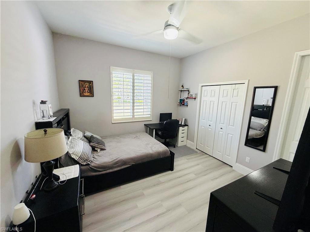 3960 1st Avenue Northwest Naples, FL 34119 - Photo 15 of 25 a bedroom with furniture and a window