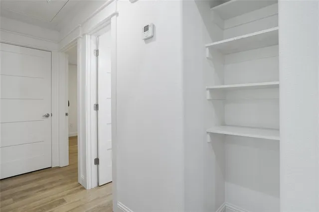 a view of an empty walk in closet