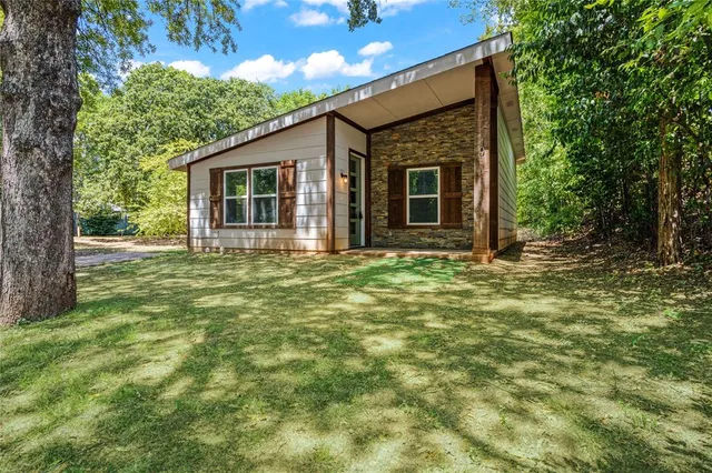 a front view of a house with garden