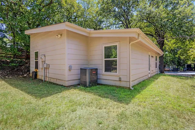 a view of a house with a yard and entertaining area