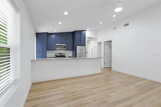 a view of kitchen with wooden floor