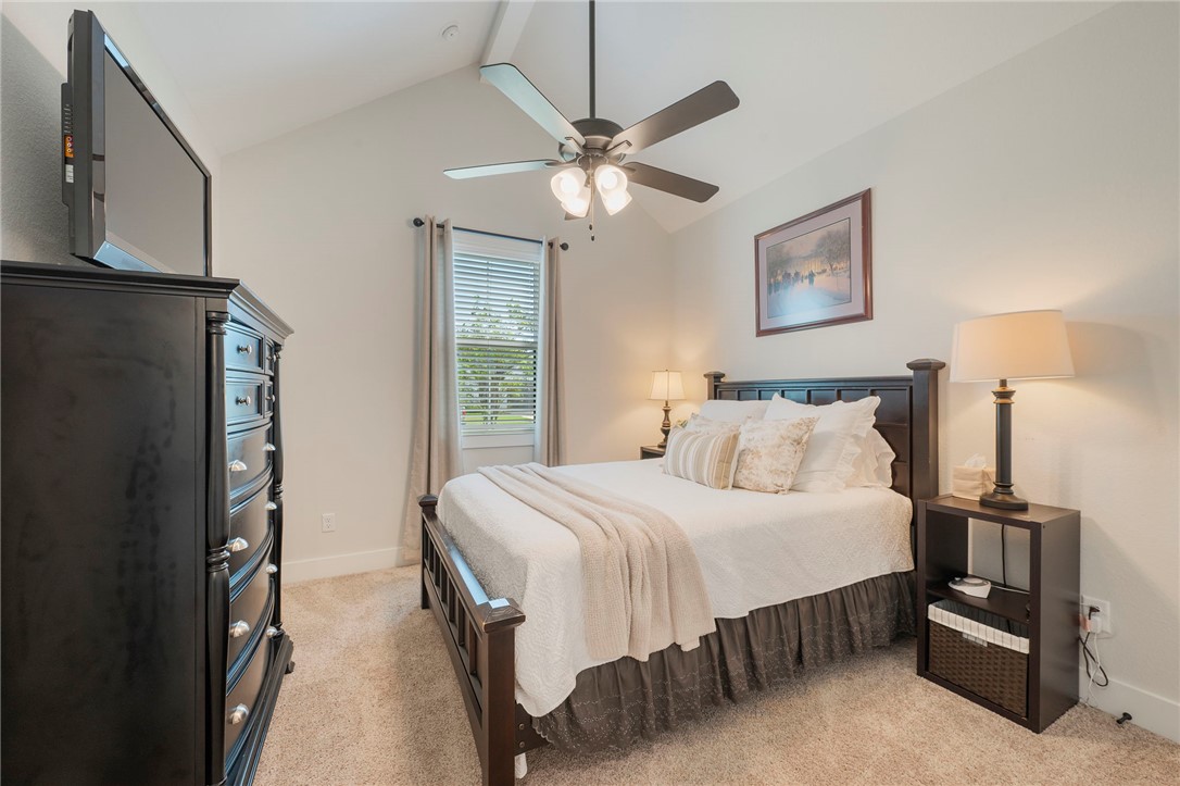 5019 Grayson Way Bryan, TX 77802 - Photo 14 of 26 Bedroom 2, with closet and vaulted ceiling, is located downstairs.