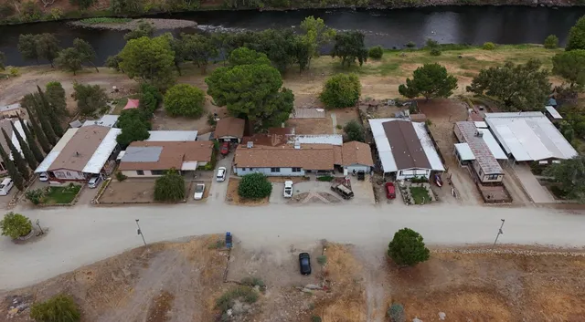 an aerial view of a house with outdoor space