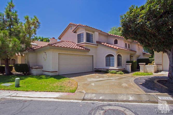 2711 Simi Hills Lane Simi Valley, CA 93063 - Photo 1 of 20 a front view of a house with a yard and garage