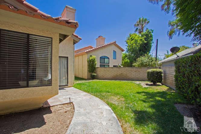2711 Simi Hills Lane Simi Valley, CA 93063 - Photo 15 of 20 a front view of a house with a yard