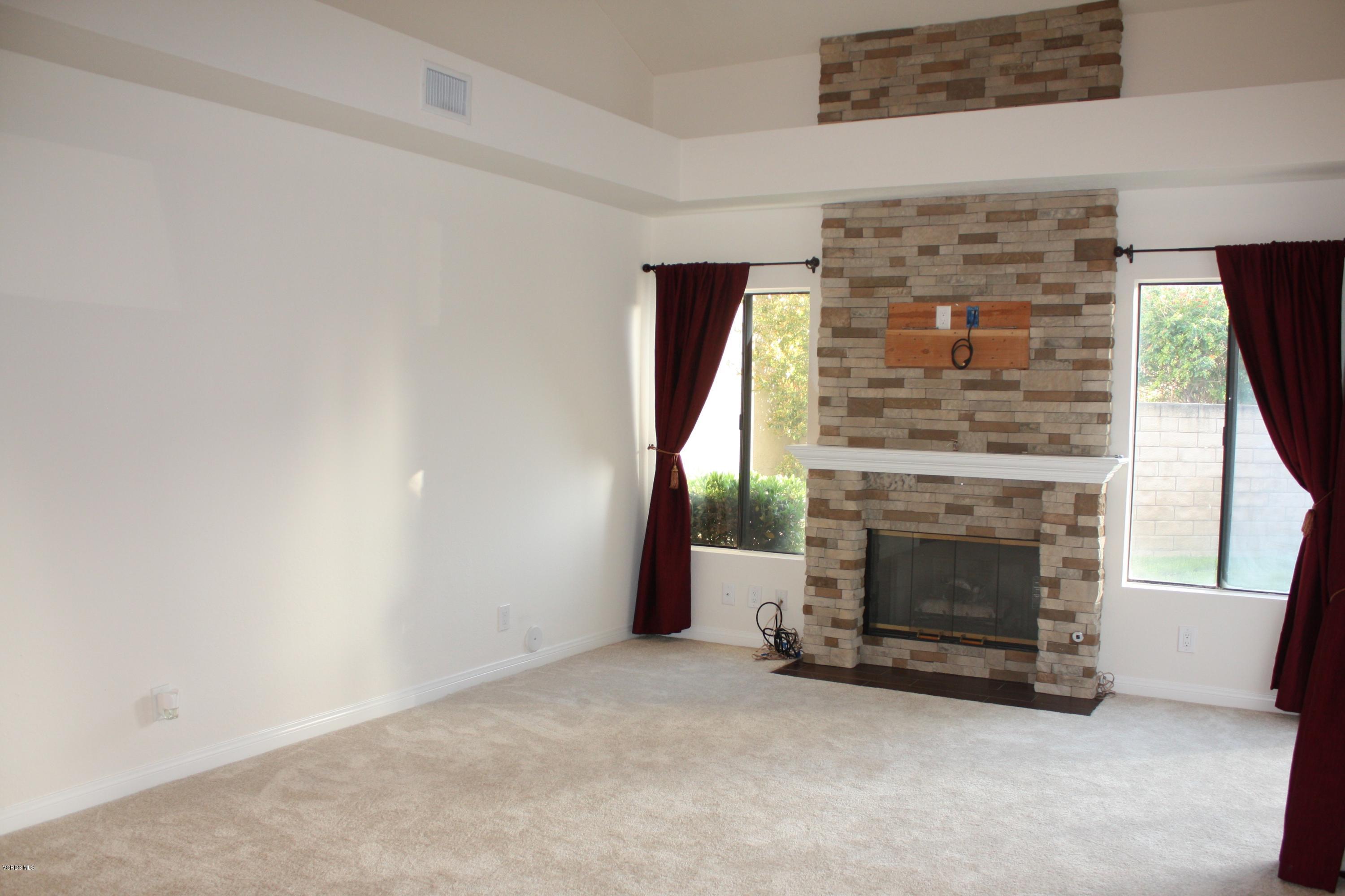 2711 Simi Hills Lane Simi Valley, CA 93063 - Photo 8 of 20 a view of empty room with fireplace and window