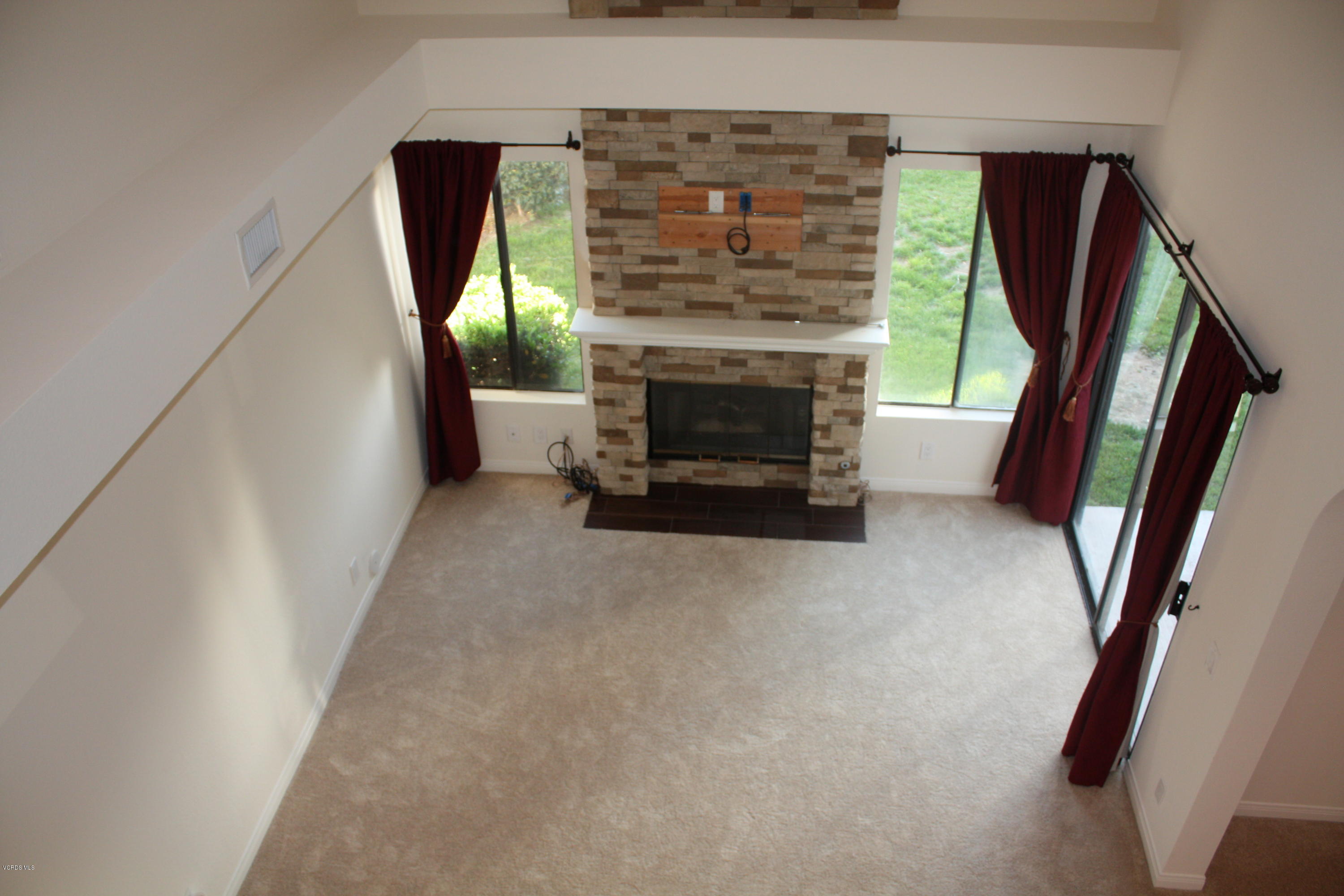 2711 Simi Hills Lane Simi Valley, CA 93063 - Photo 10 of 20 a living room with furniture and a fireplace