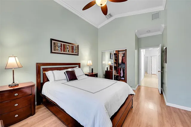 a bed room with a bed and a mirror